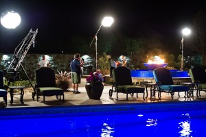 Sean Gallagher and the film crew busy at work as dusk falls upon a pool project at a private residence in Texas